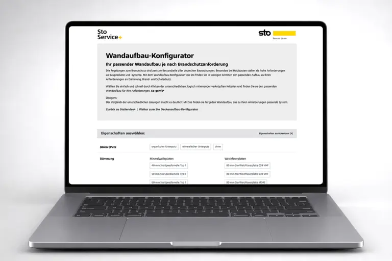Aufgeklappter Laptop mit der offenen Website des Wandaufbau-Konfigurators.