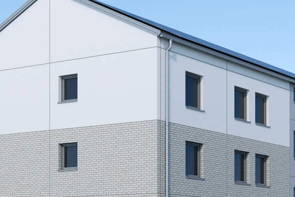 Saniertes Gebäude mit vorgefertigten Putzelementen und Klinker