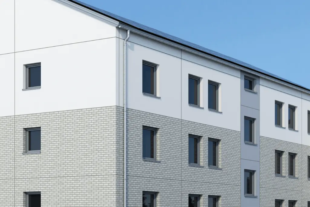 Saniertes Gebäude mit vorgefertigten Putzelementen und Klinker